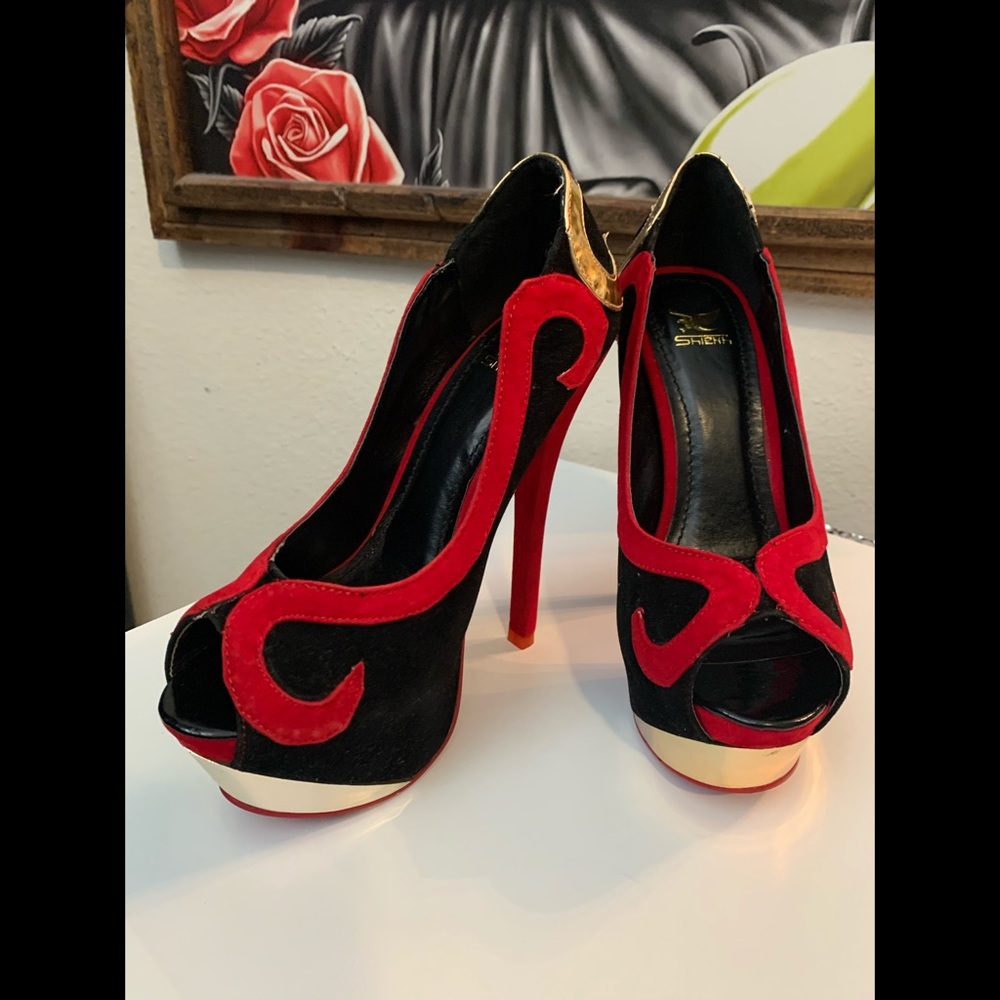 Back and Red suede Heels with Gold accent. Size 6